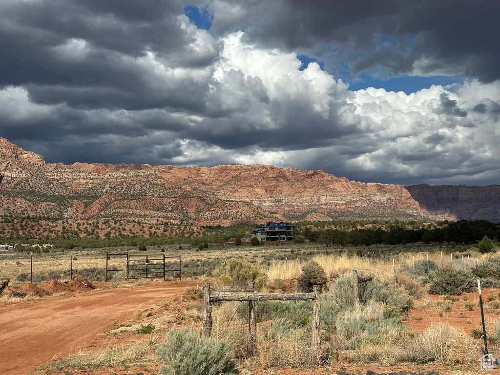 View of mountain background featuring rural landscape