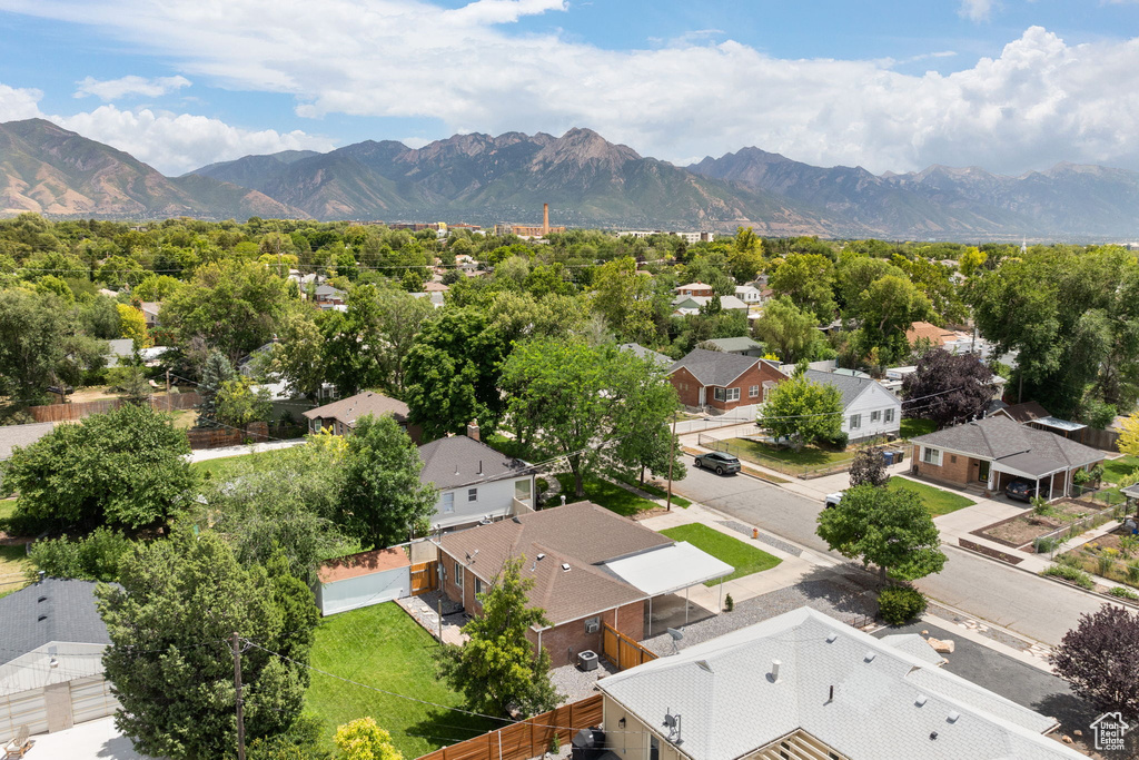 Aerial perspective of suburban area featuring a mountain backdrop