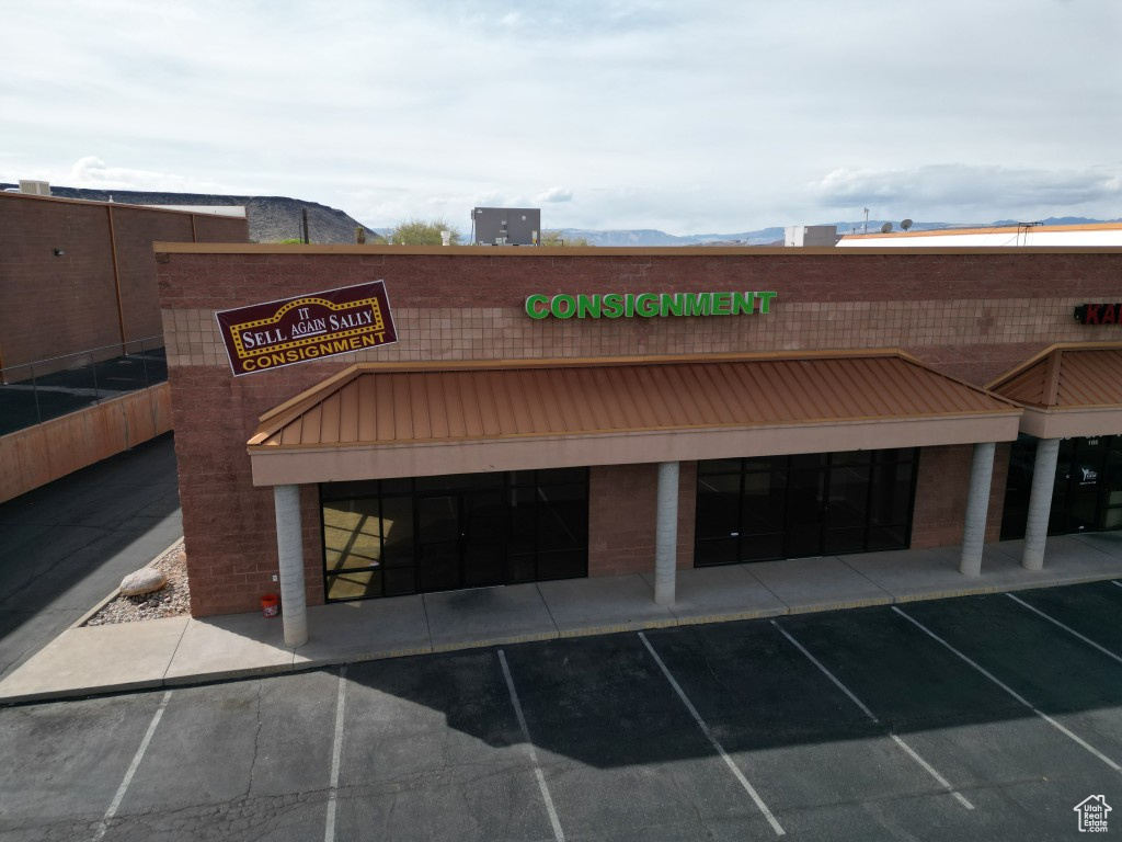 View of property with uncovered parking
