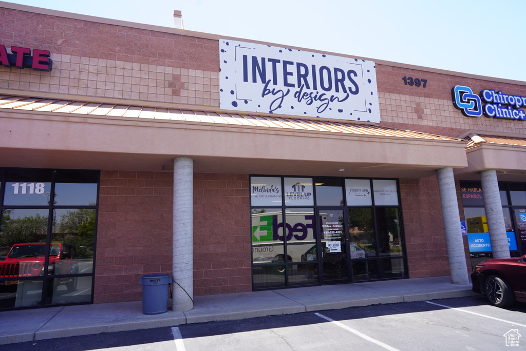 View of commercial property with a parking lot