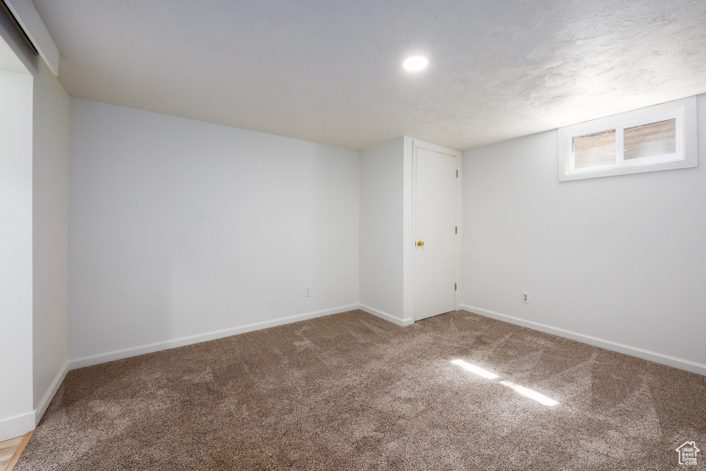 Below grade area with carpet and recessed lighting