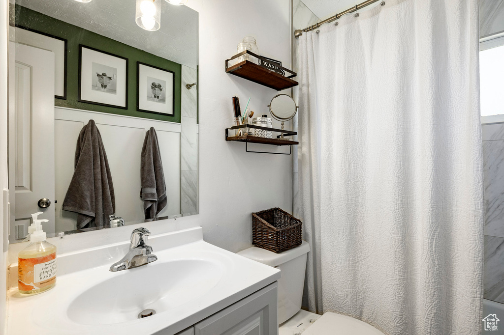 Bathroom with vanity and a shower with shower curtain