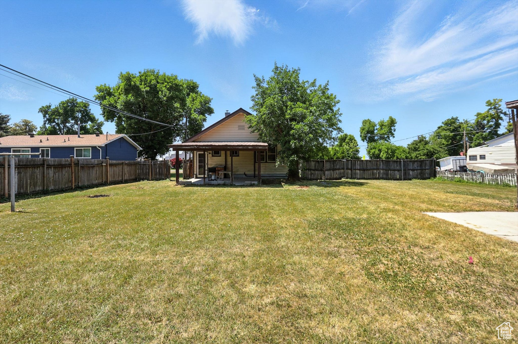 Fenced backyard featuring a patio area