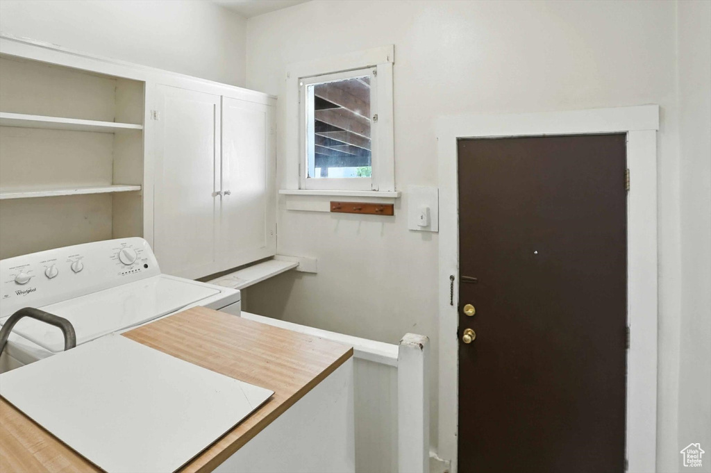 Laundry area with cabinet space and washer / clothes dryer