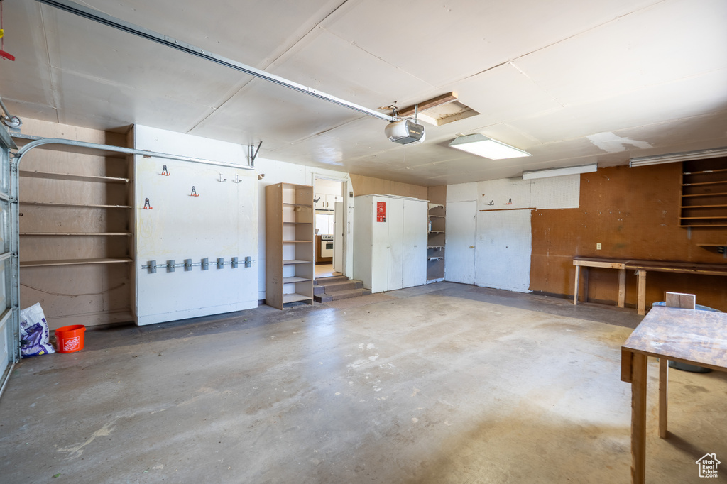 Garage featuring a garage door opener