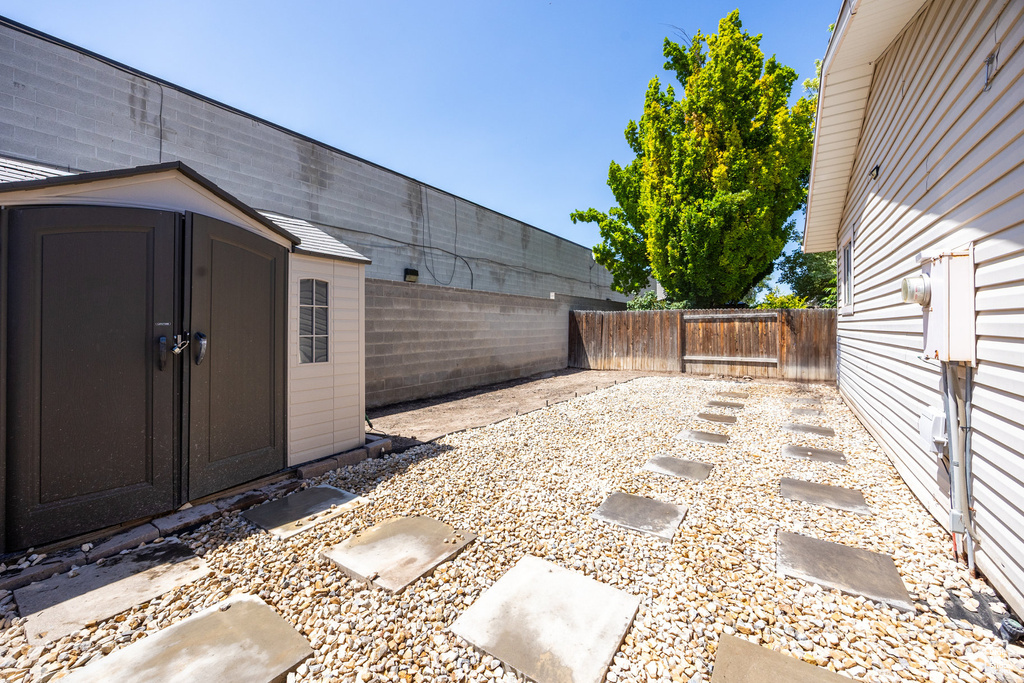 Fenced backyard with a shed