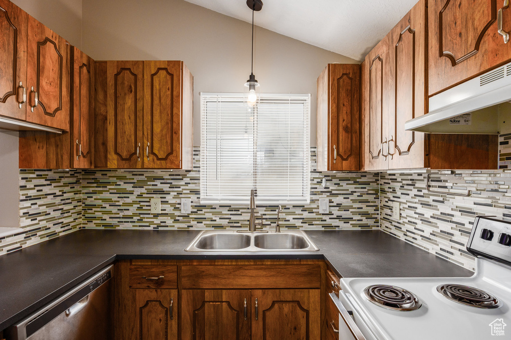 Kitchen featuring white range with electric cooktop, stainless steel dishwasher, dark countertops, vaulted ceiling, and decorative backsplash