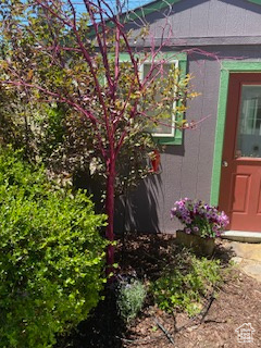 Property entrance featuring concrete block siding