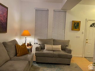 Living room featuring baseboards and wood finished floors