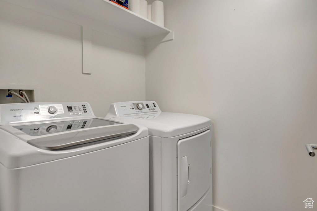 Washroom featuring independent washer and dryer