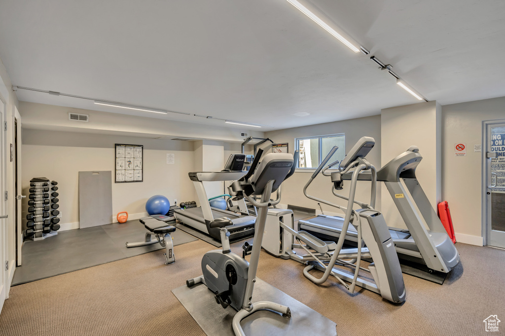 Workout area featuring baseboards