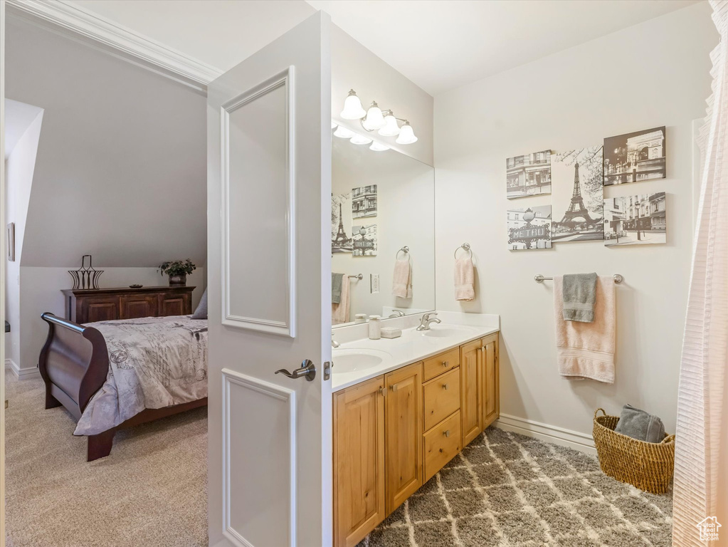 Full bath with double vanity and connected bathroom