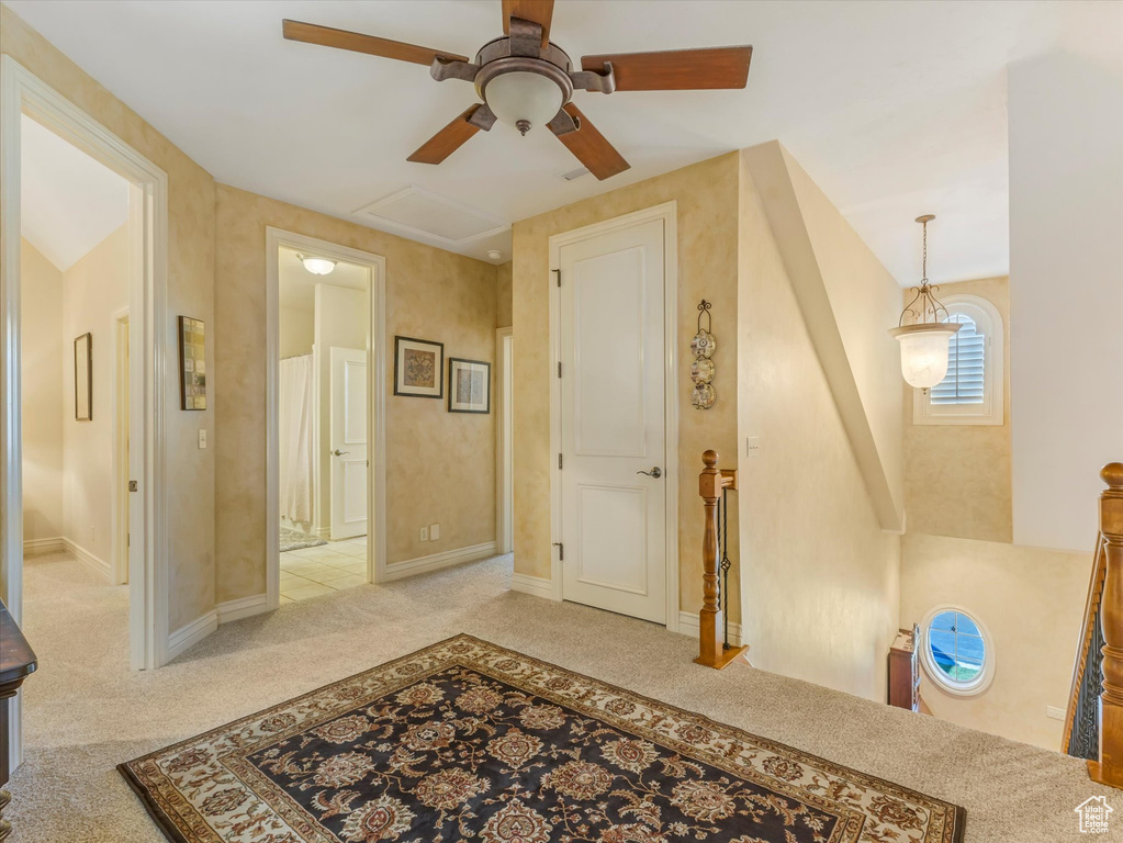 Corridor with carpet floors and baseboards