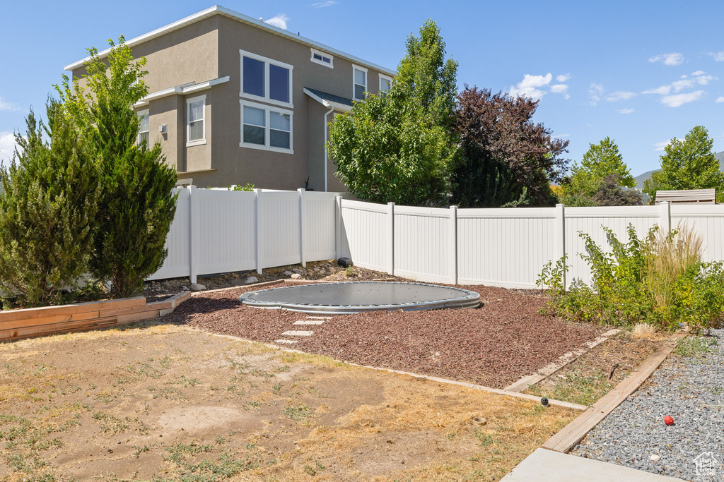 View of fenced backyard