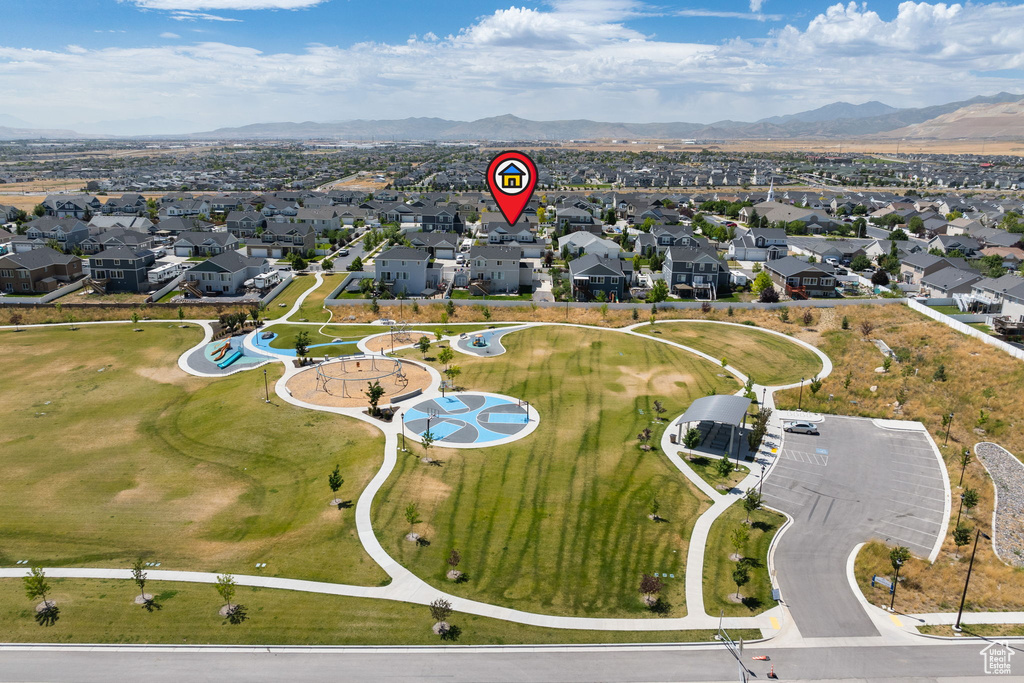 Aerial view of property\'s location with nearby suburban area and a mountain backdrop