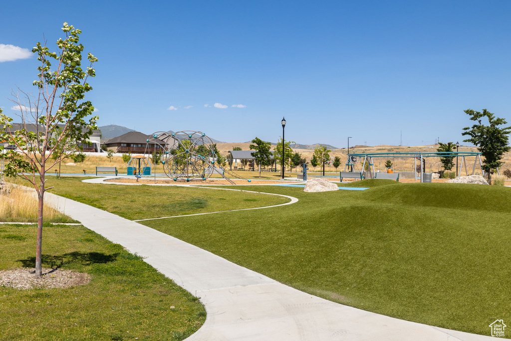 View of property\'s community featuring a yard