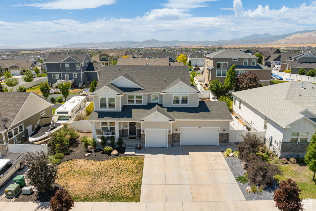 Aerial perspective of suburban area featuring a mountainous background