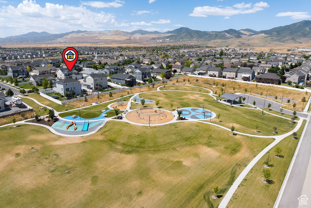 View of property location featuring nearby suburban area and a mountain backdrop