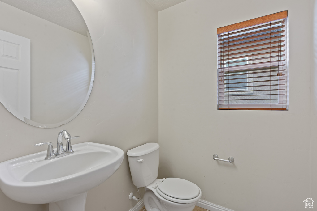 Bathroom with baseboards and a sink