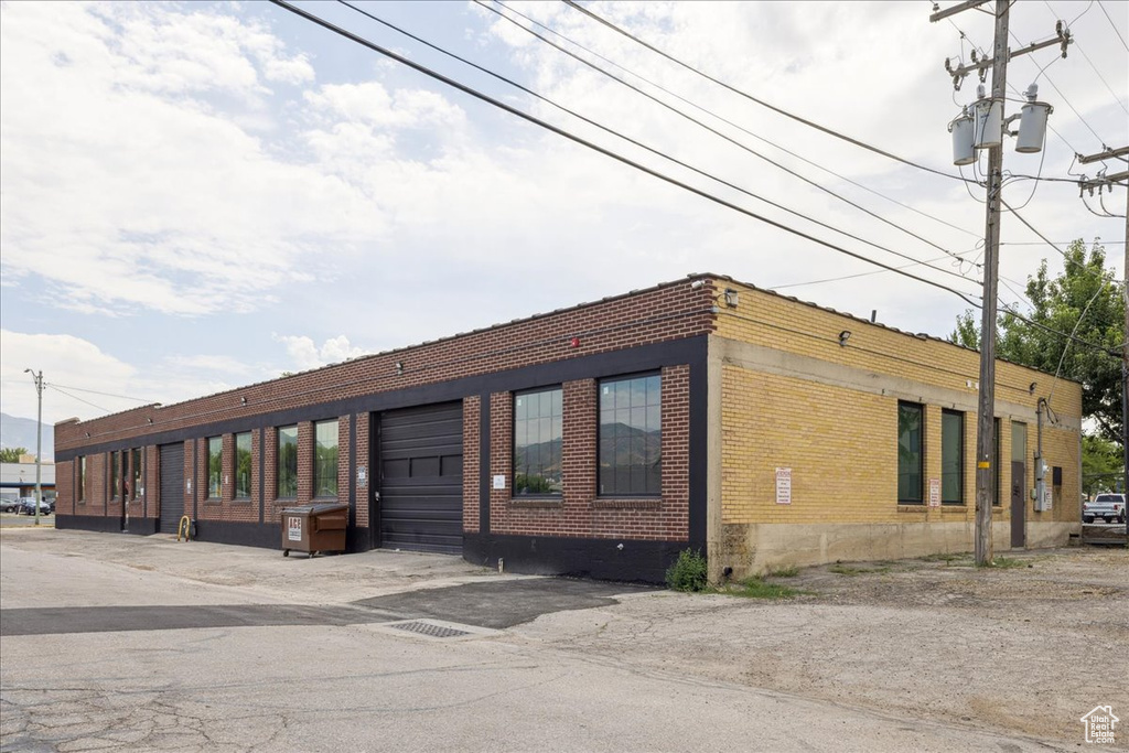 View of property featuring an attached garage