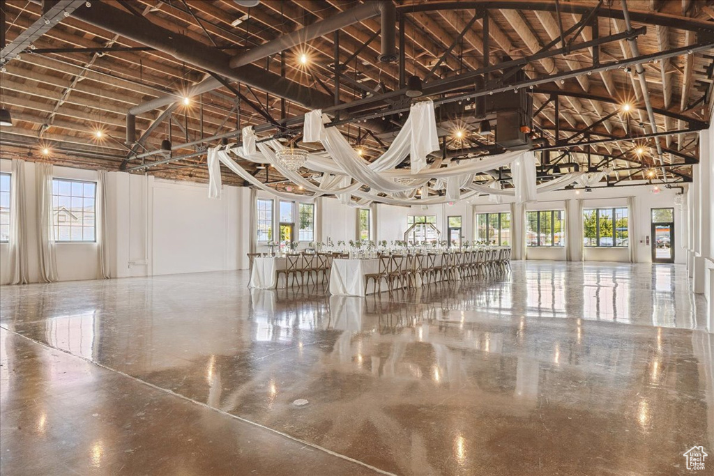 Misc room featuring high vaulted ceiling and plenty of natural light