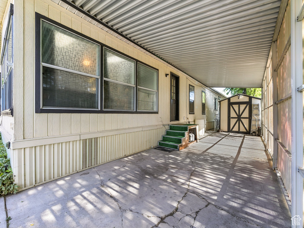 View of patio / terrace with a storage shed