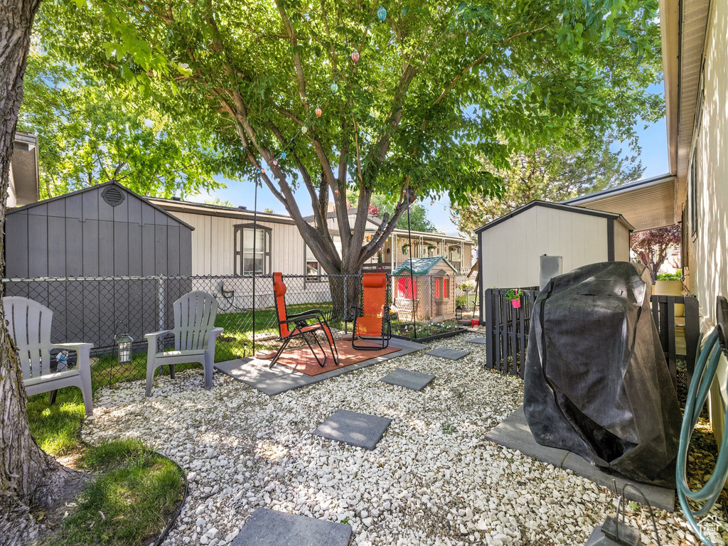 View of yard with a storage unit