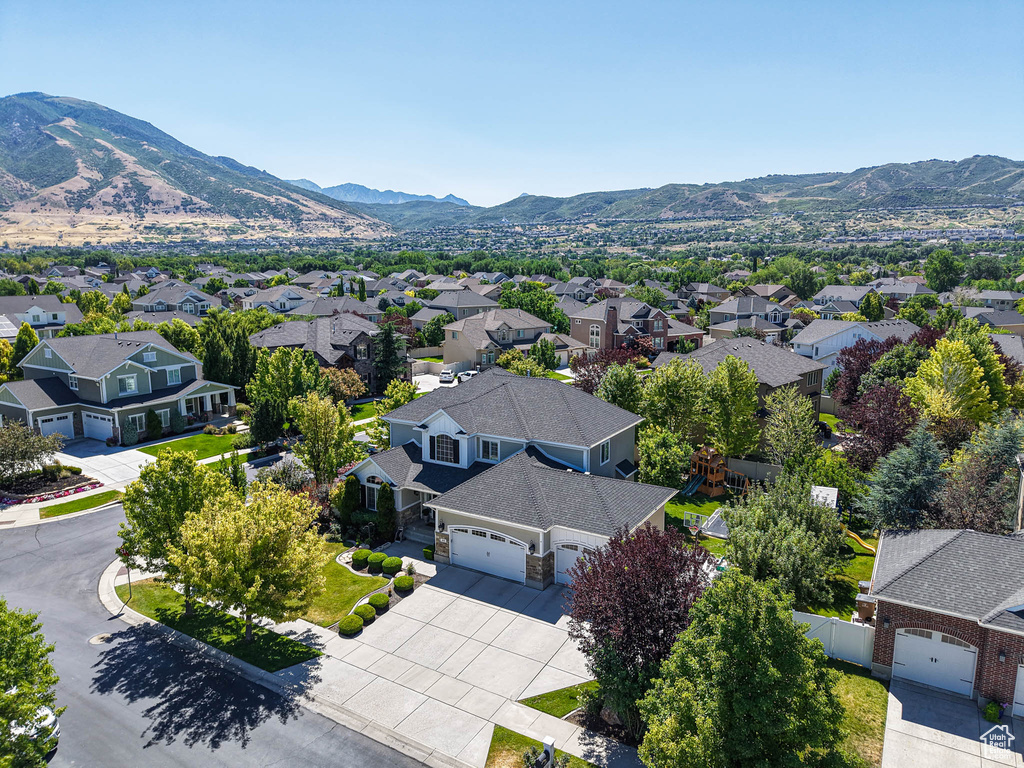 Aerial view of residential area with a mountain backdrop