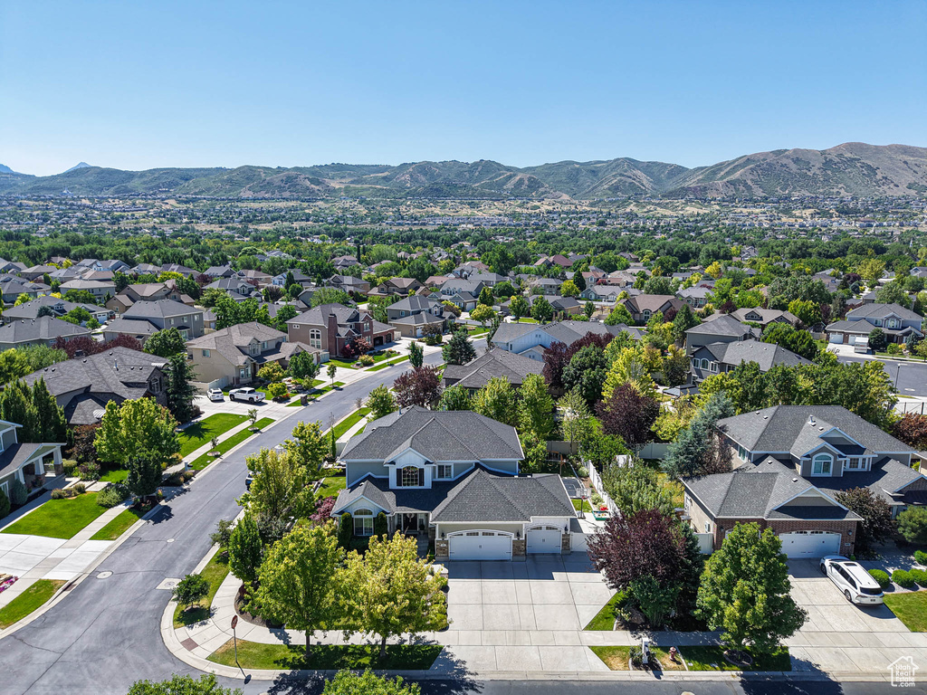 Aerial perspective of suburban area with a mountain backdrop