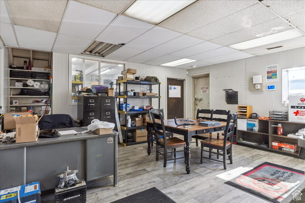 Dining room featuring a paneled ceiling, wood finished floors, and an office area
