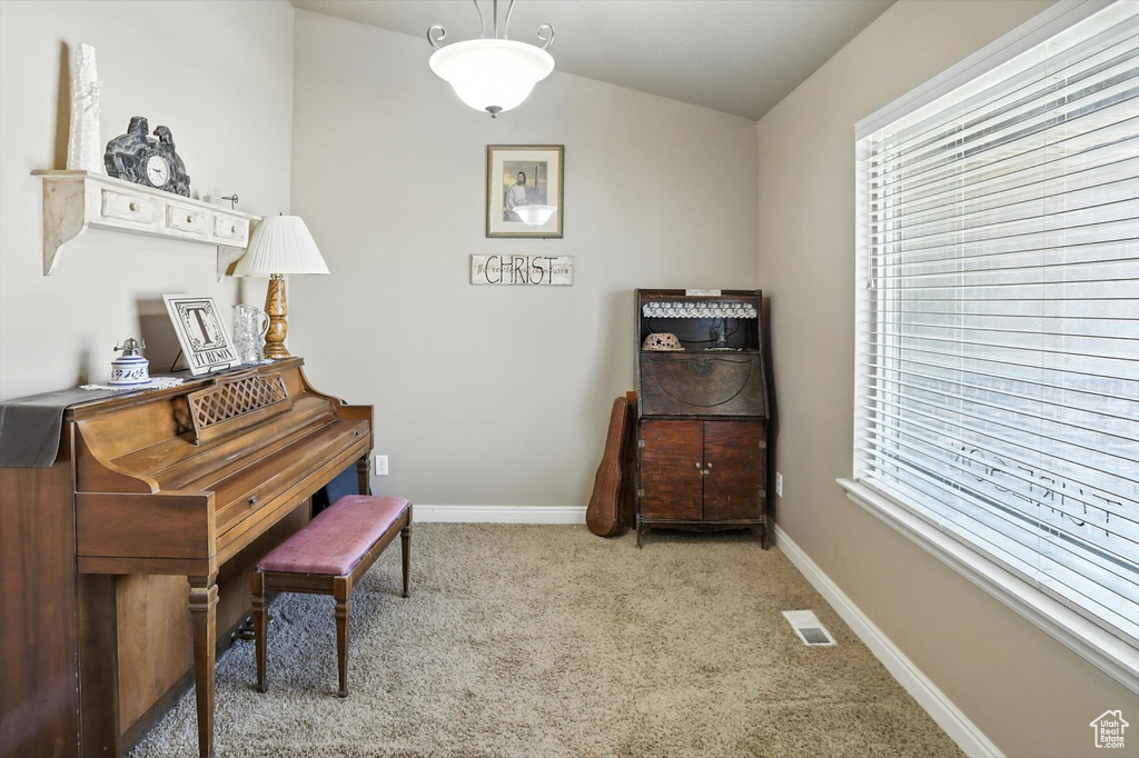 Sitting room with carpet flooring and baseboards