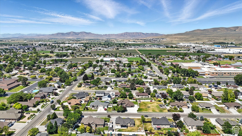 Aerial view of residential area with a mountainous background