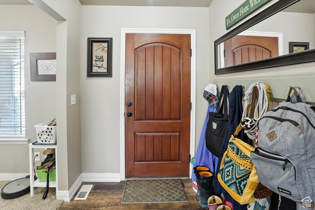 Foyer entrance featuring baseboards