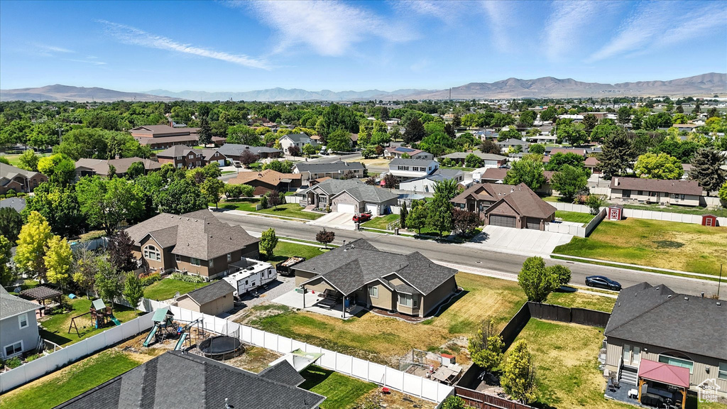 Aerial perspective of suburban area with a mountainous background