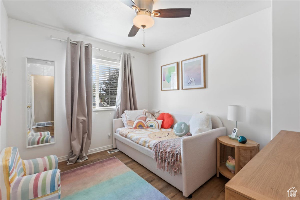 Bedroom with wood finished floors and ceiling fan