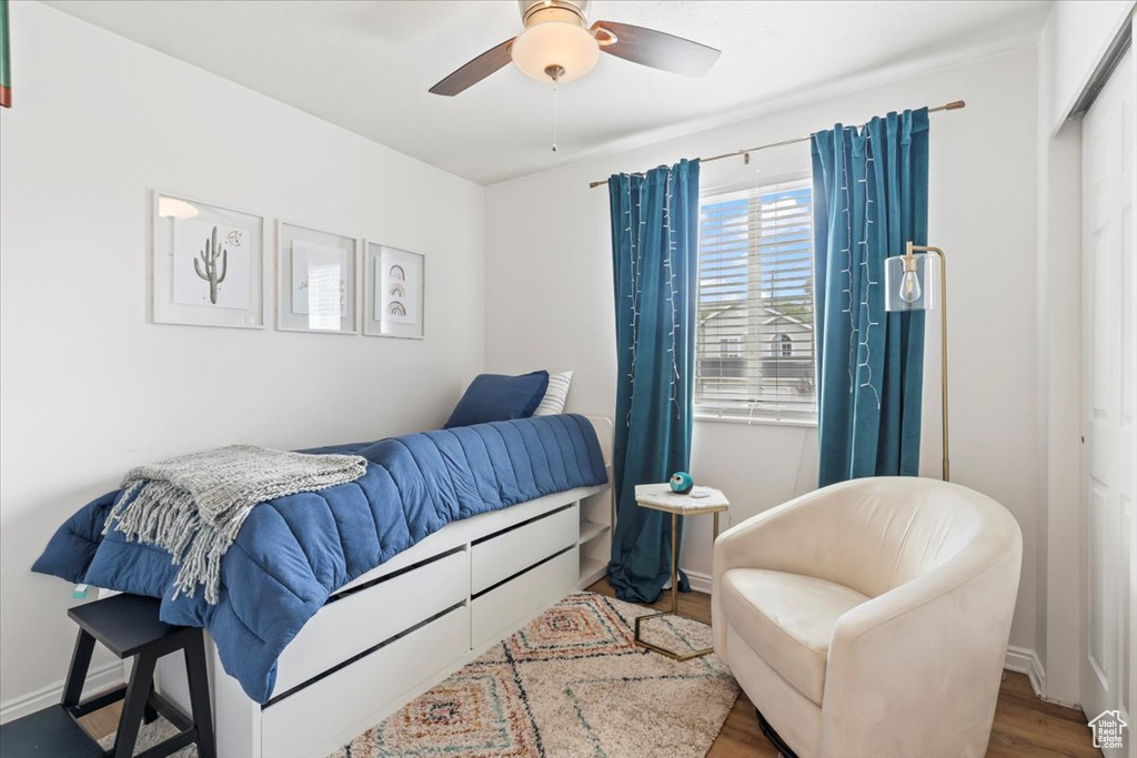 Bedroom featuring wood finished floors and ceiling fan