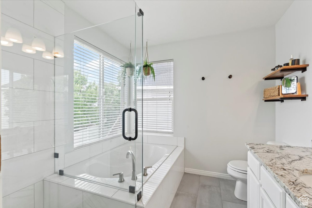 Bathroom featuring vanity and a bath