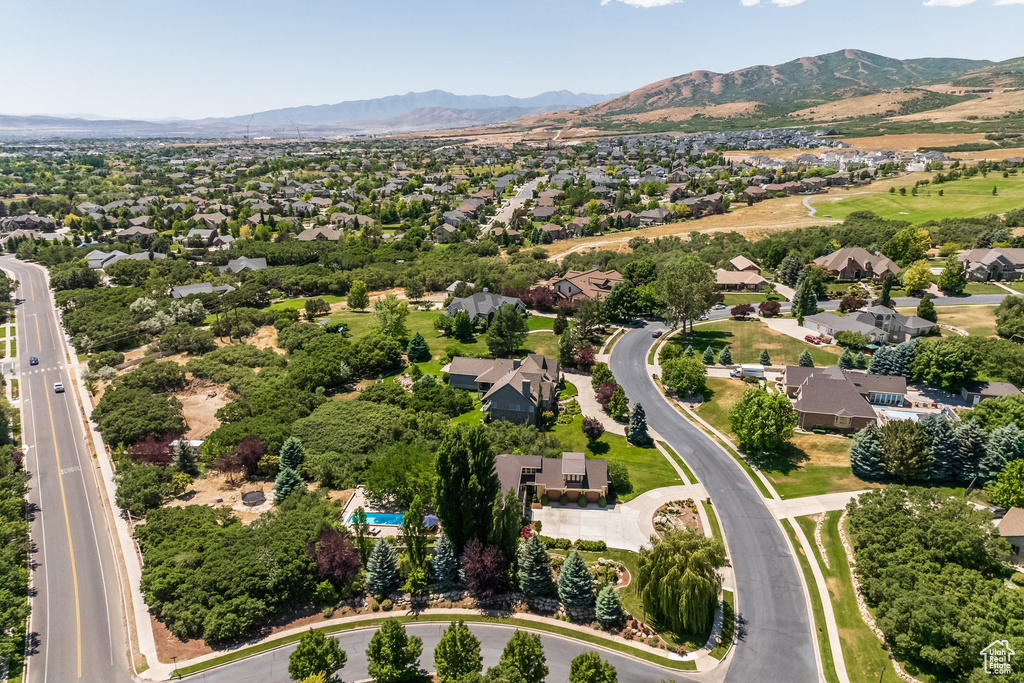 Aerial perspective of suburban area featuring a mountain backdrop
