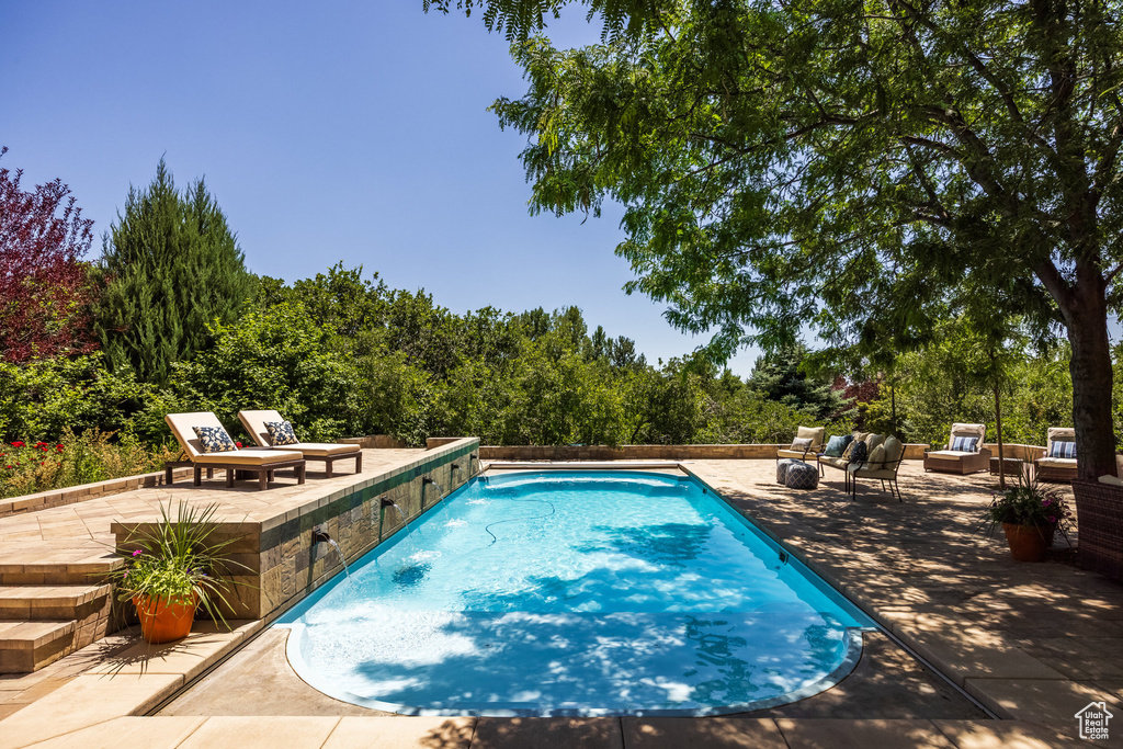 Outdoor pool with a patio area