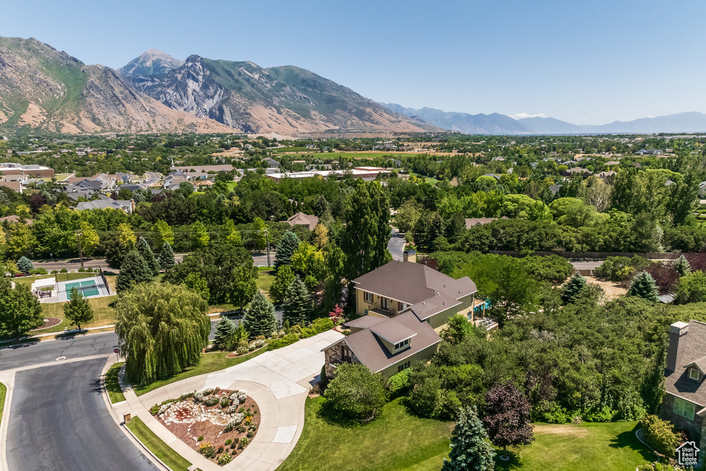 Aerial view of residential area featuring a mountainous background