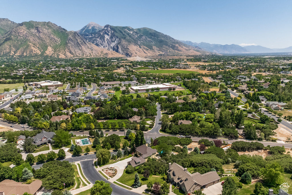 Aerial view of residential area featuring a mountainous background
