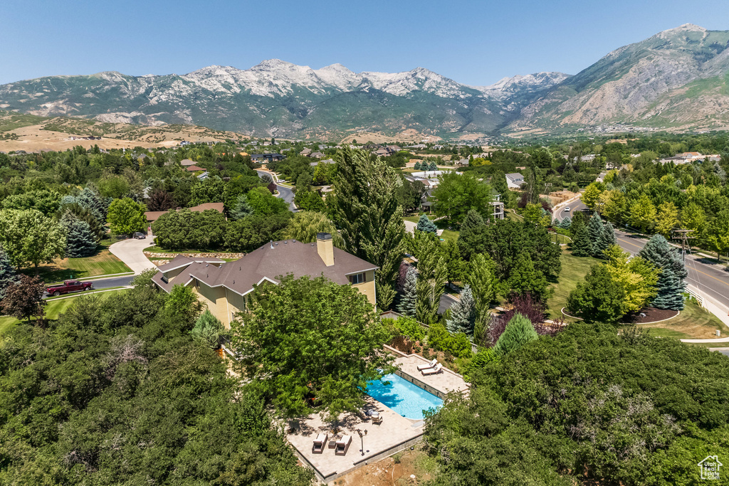 View of property location with mountains and a pool