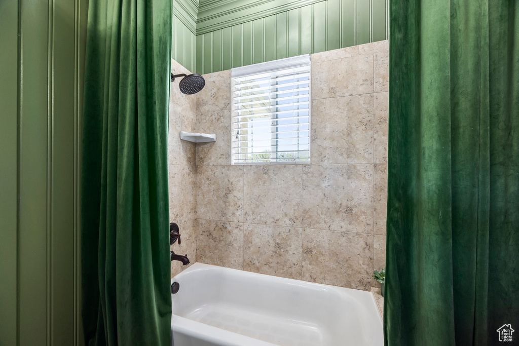 Bathroom featuring shower / bath combo with shower curtain