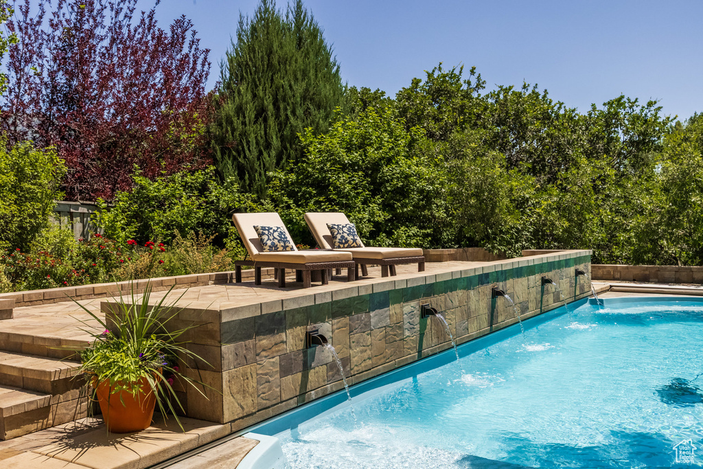 Swimming pool with a patio