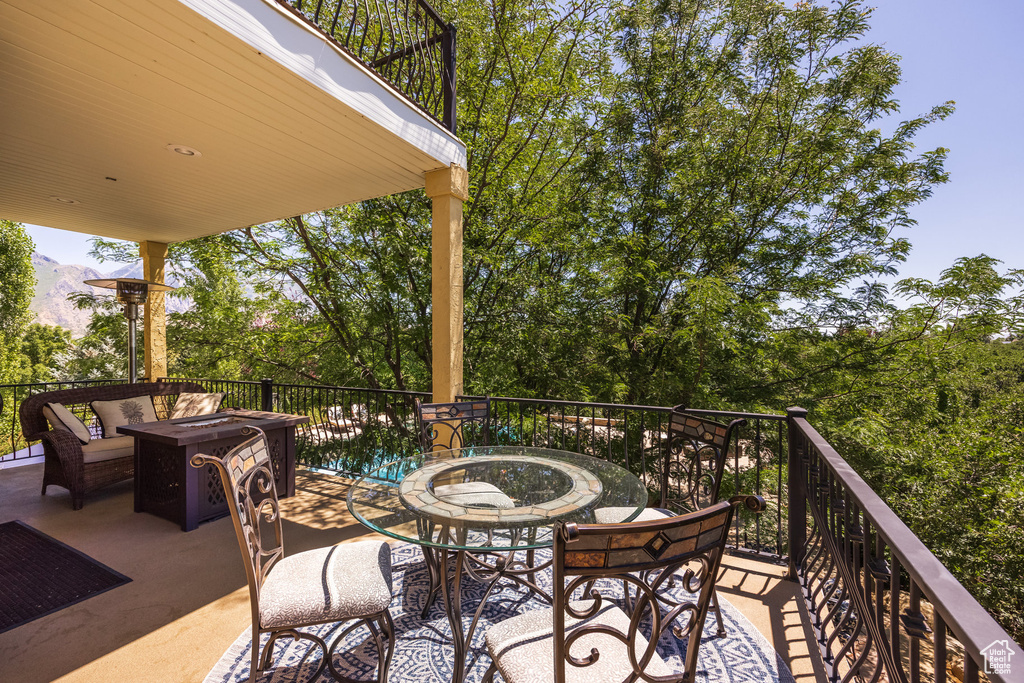 Patio / terrace featuring an outdoor living space with a fire pit, a mountain view, and a patio area