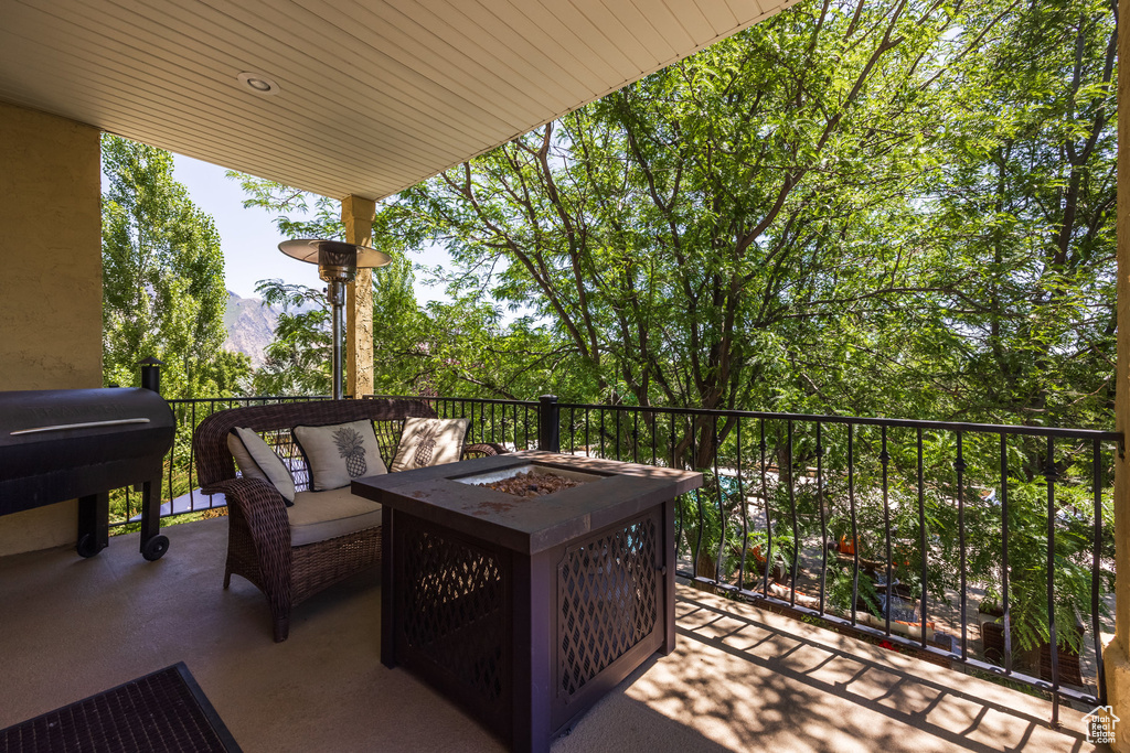 Patio / terrace with a fire pit and a mountain view