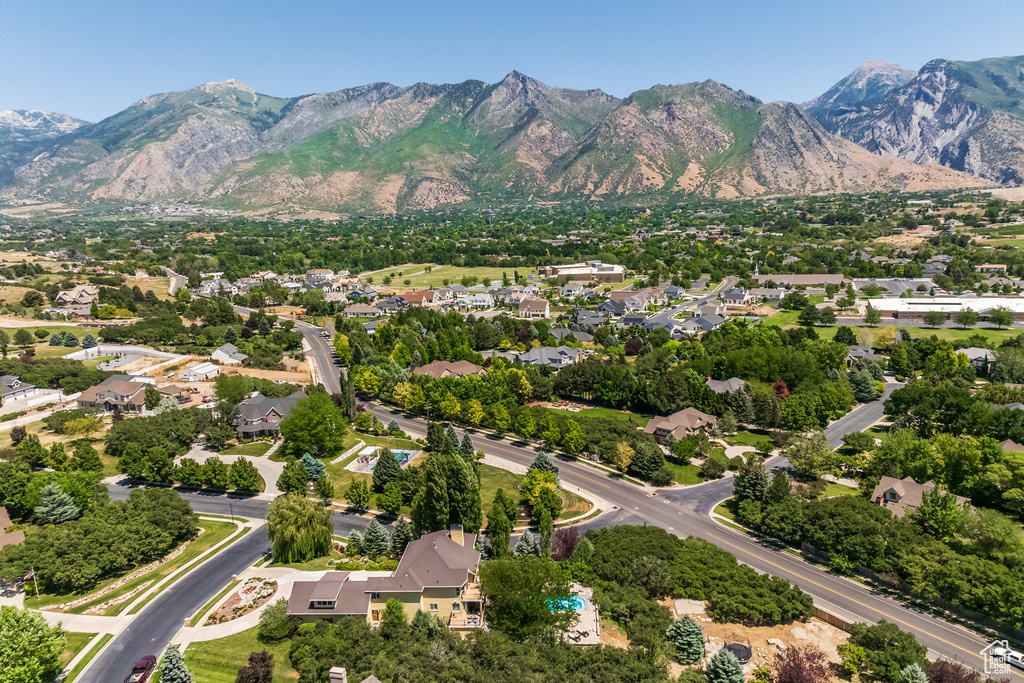 Aerial perspective of suburban area featuring a mountainous background