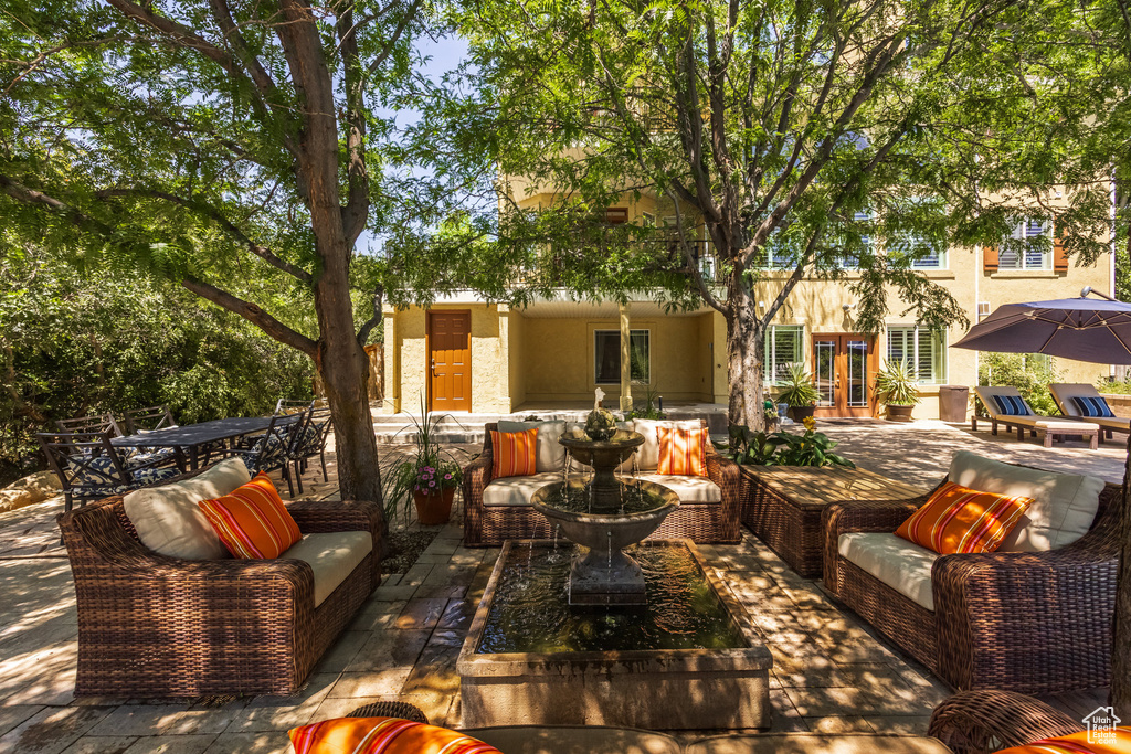 View of patio / terrace featuring french doors, outdoor dining area, and an outdoor living space
