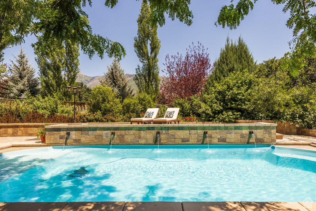Swimming pool featuring a mountain view