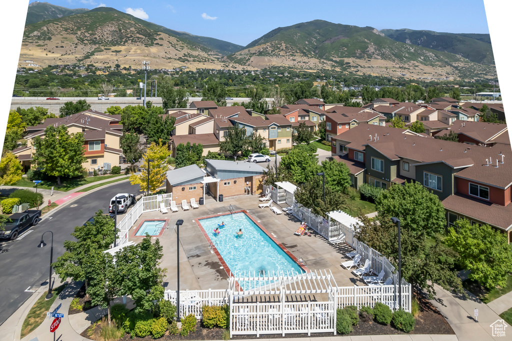 Aerial view of a pool area and a mountain backdrop